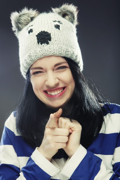 Young woman in funny winter hat