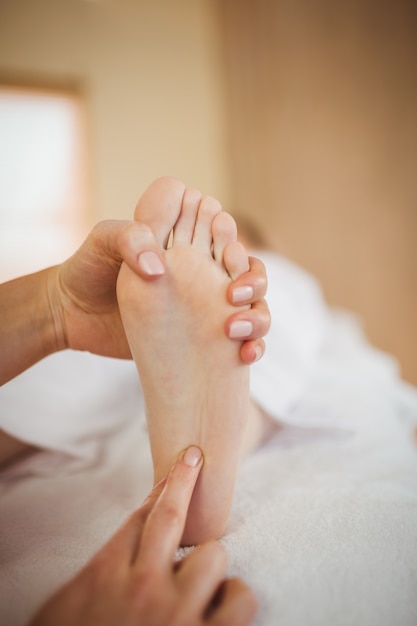 Young woman getting foot massage