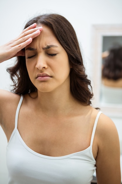 Young woman getting a headache