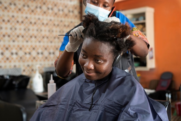 Young woman getting her hair done at the salon