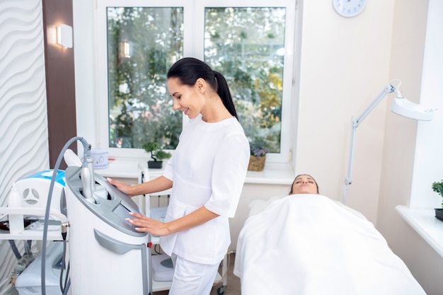 Young woman getting an ultrasound massage therapy