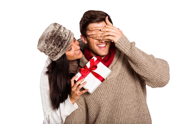 Young woman giving gift to boyfriend