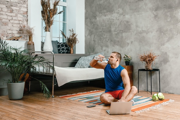 The young woman goes in for sports at home