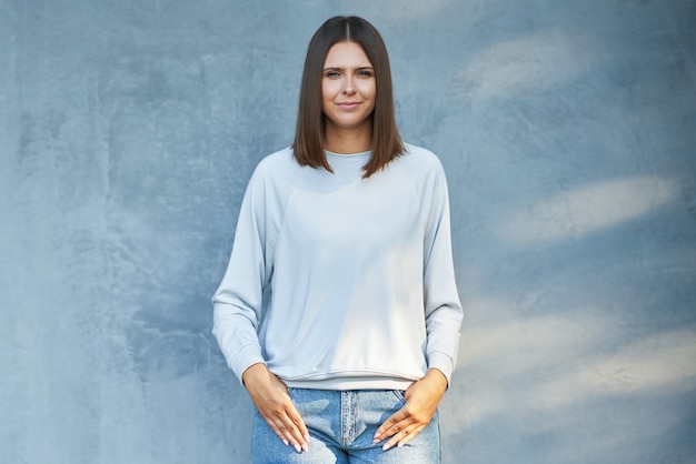 Young woman in gray blouse. High quality photo