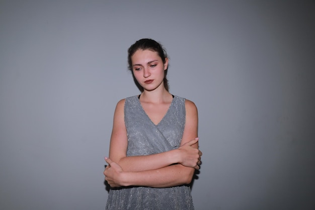 Young woman in grey dress