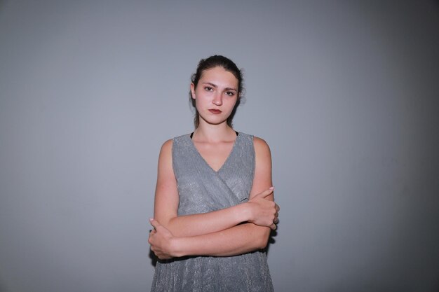 Young woman in grey dress