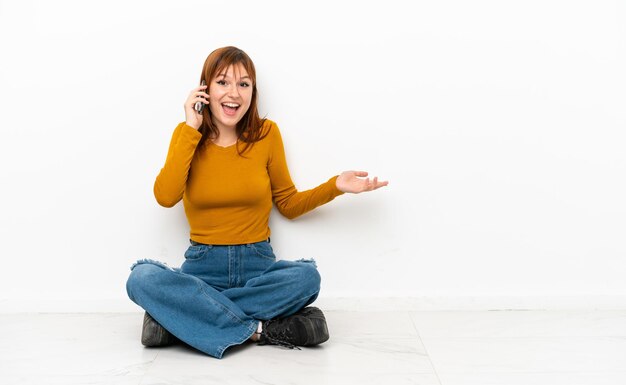 Young woman on grunge background shouting with mouth wide open