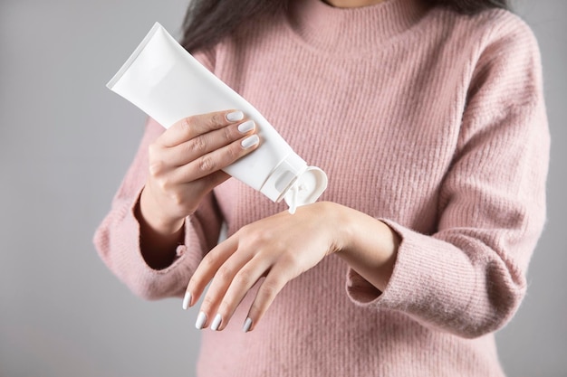 Young woman hand cream