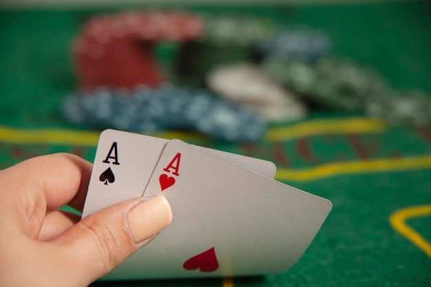 Young woman hand poker cards