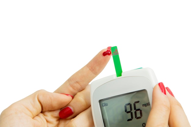 Young woman hands checking her blood glucose