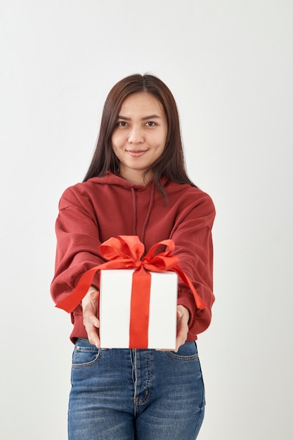 Young woman happy hold gift box in hands