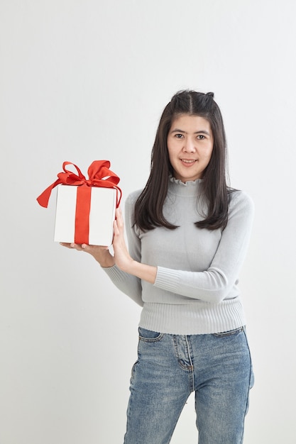 Young woman happy hold gift box in hands