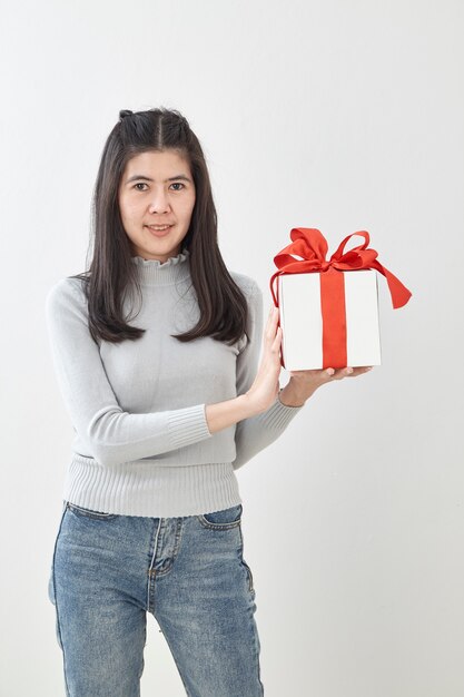 Young woman happy hold gift box in hands