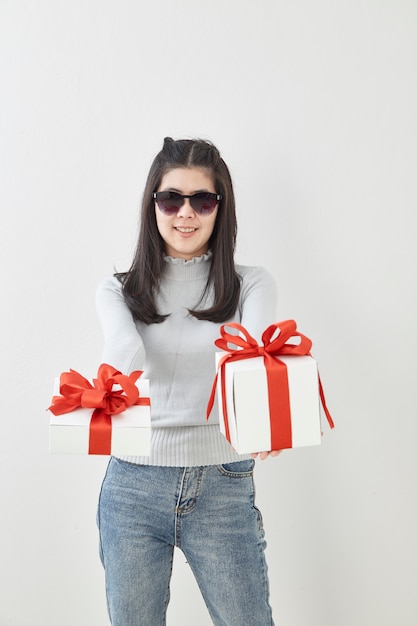 Young woman happy hold gift box in hands