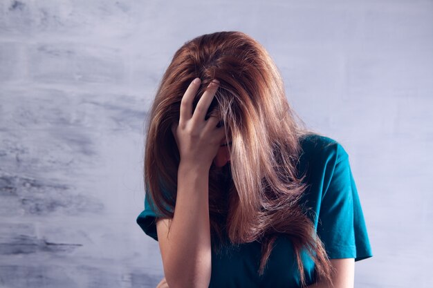 A young woman has a headache