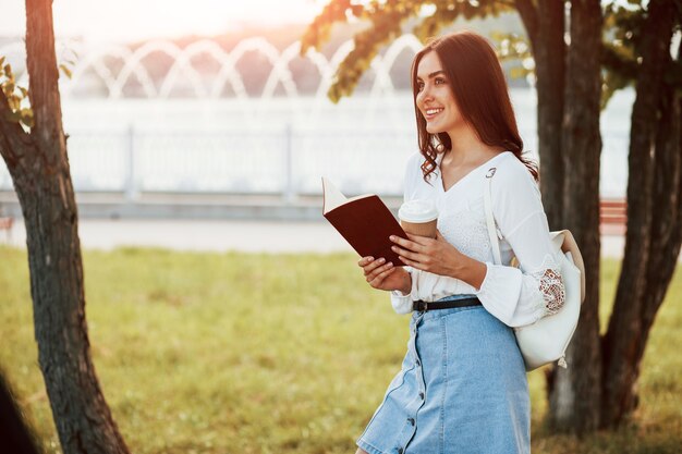 Young woman have good time in the park at her weekend