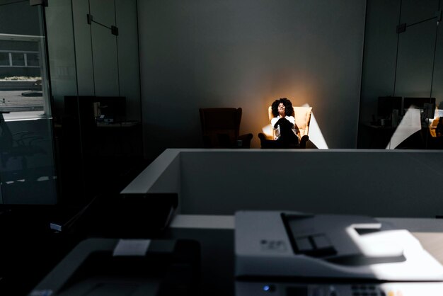 Young woman having a break in office