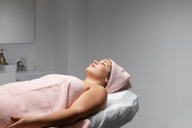 Young woman having a facial treatment at the beauty salon