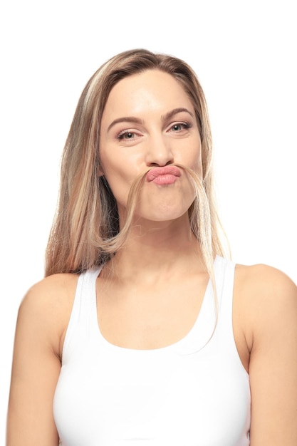Young woman having fun on white background