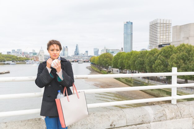 Young woman having lunch in London