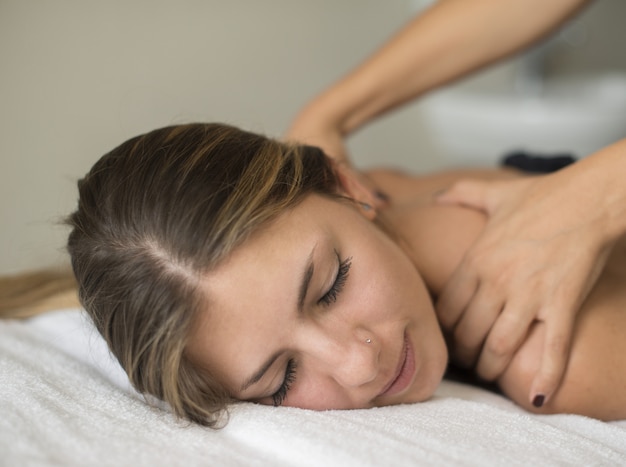 Young woman having a massage in a spa