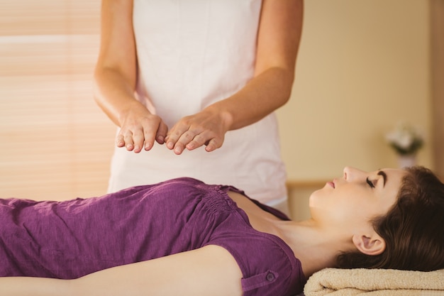 Young woman having a reiki treatment