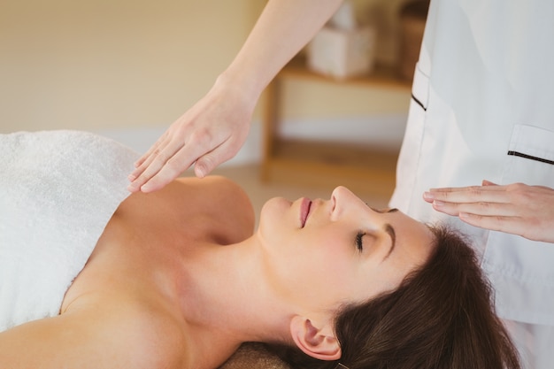 Young woman having a reiki treatment