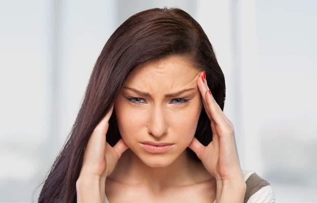 young woman having splitting headache