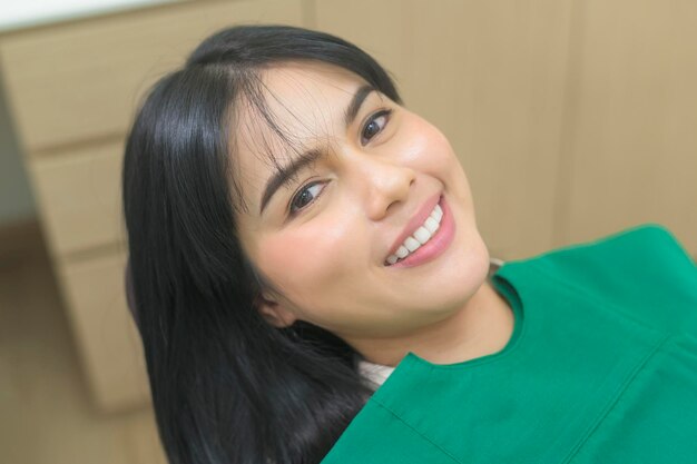 A young woman having teeth examined by dentist in dental clinic teeth