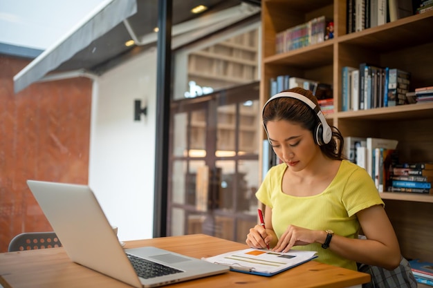 young woman having video call via computer in the home officebusiness video conferencing