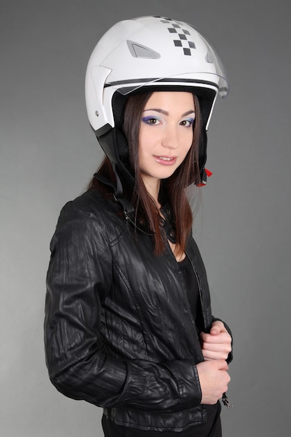 Young woman in helmet on head
