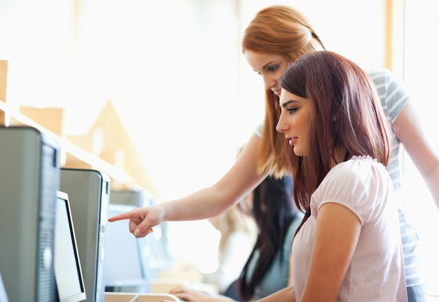 Young woman helping her friend