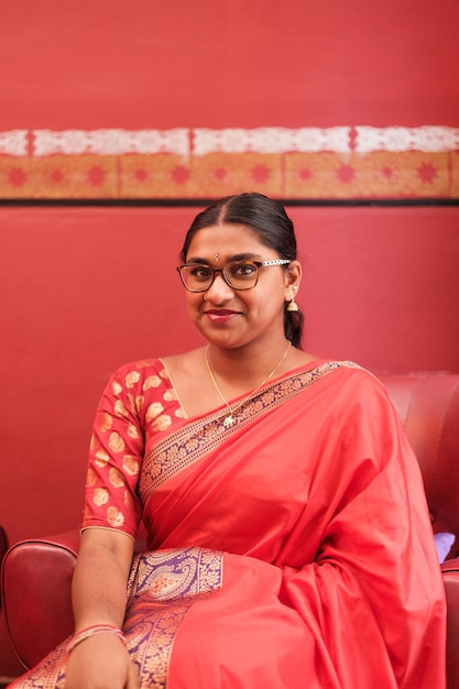 Young woman of Hindu culture sitting with the native clothing of her religion Concept lifestyle celebration