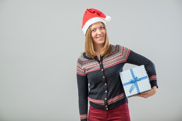 Young woman hold christmas gift