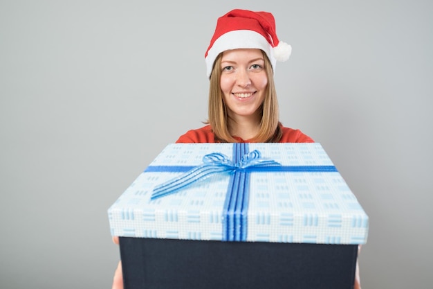 Young woman hold christmas gift