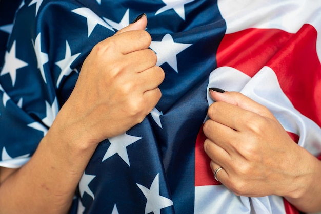 Young woman holding American flag