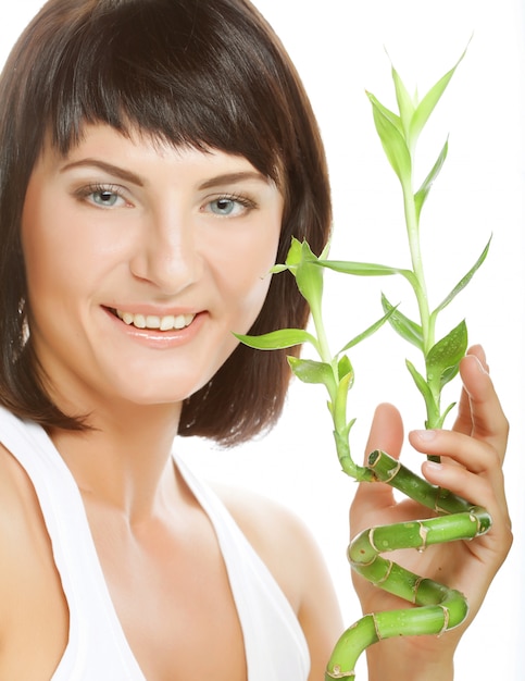 Young woman holding bamboo