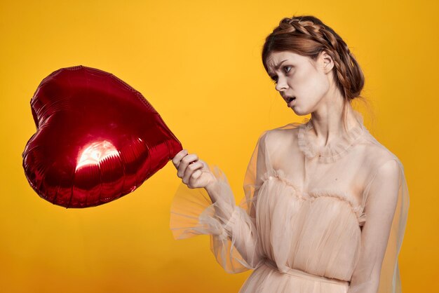 Young woman holding bauble