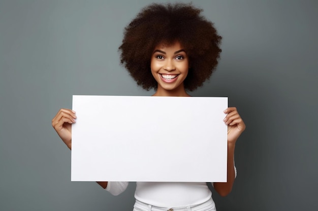 A young woman holding a blank blackboard