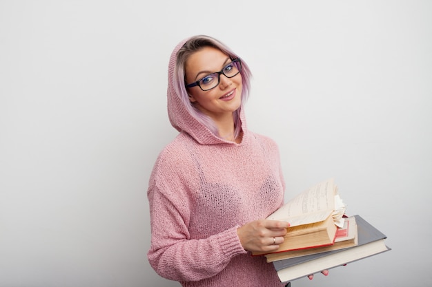 Young woman holding books