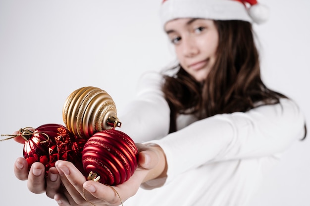 Young woman holding Christmas balls