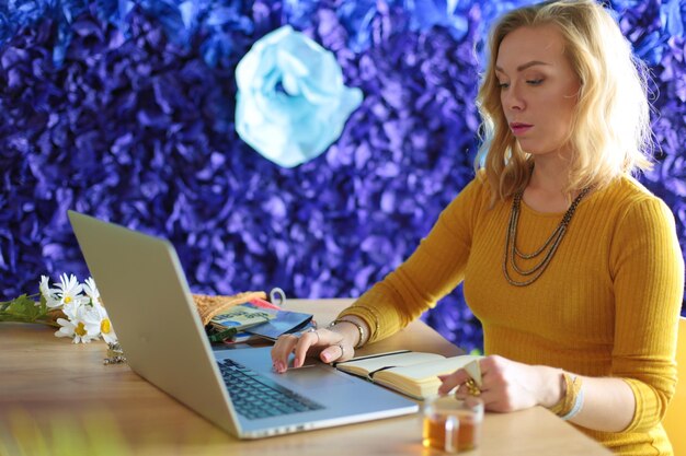 Young woman holding credit card and using laptop computer Online shopping concept