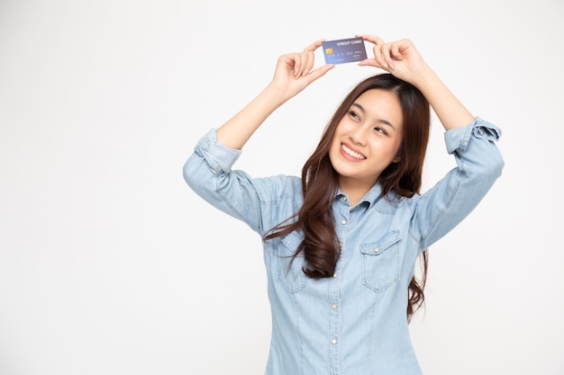 Young woman holding credit card