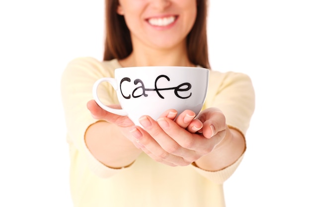 a young woman holding a cup of coffee over white background