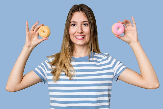 Young woman holding doughnut dessert isolated