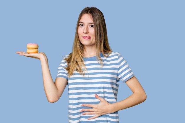 Young woman holding doughnut dessert isolated