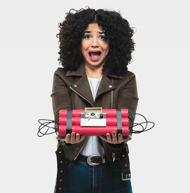 Young woman holding a dynamite