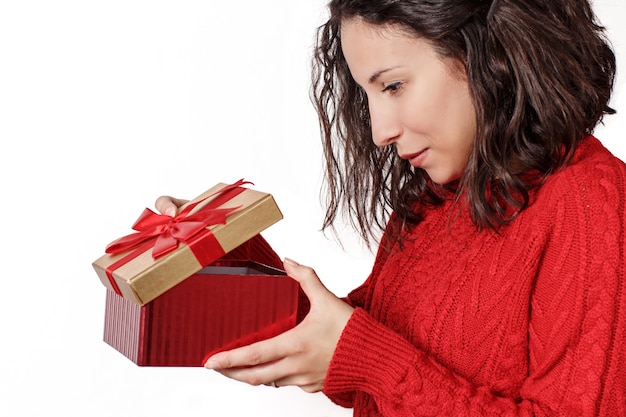 young woman holding Gift in hands close up