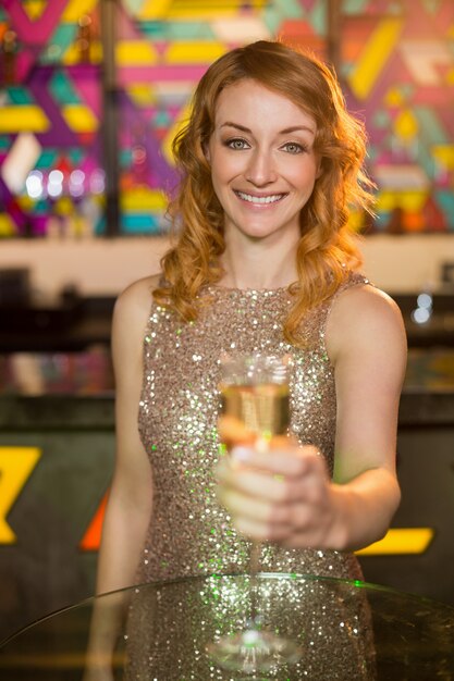 Young woman holding a glass of champagne