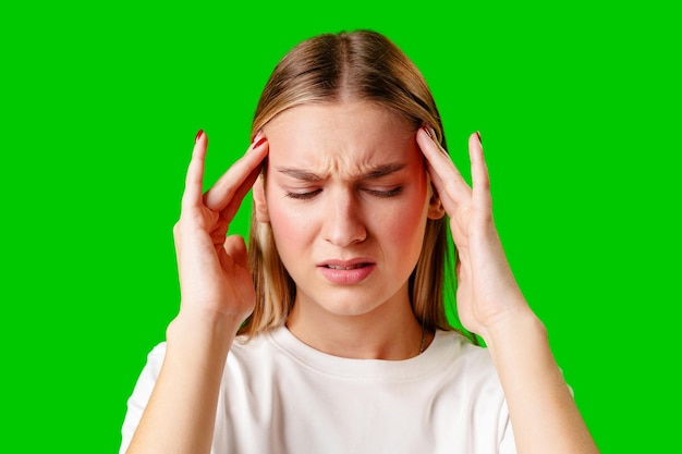 Young woman holding head with hands headache concept